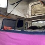 Cat sleeping in a camper van